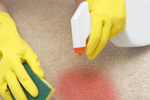 Professional carpet cleaning team in SE10 working on a residential carpet